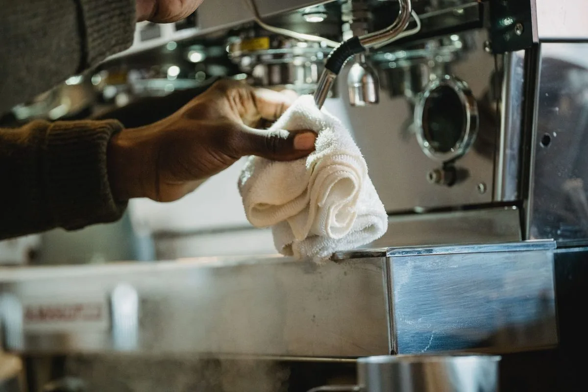 Cleaner polishing stainless steel in a commercial kitchen