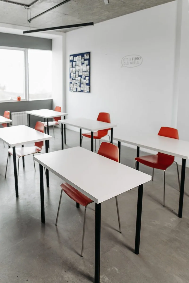 Bright, freshly cleaned classroom with tidy desks